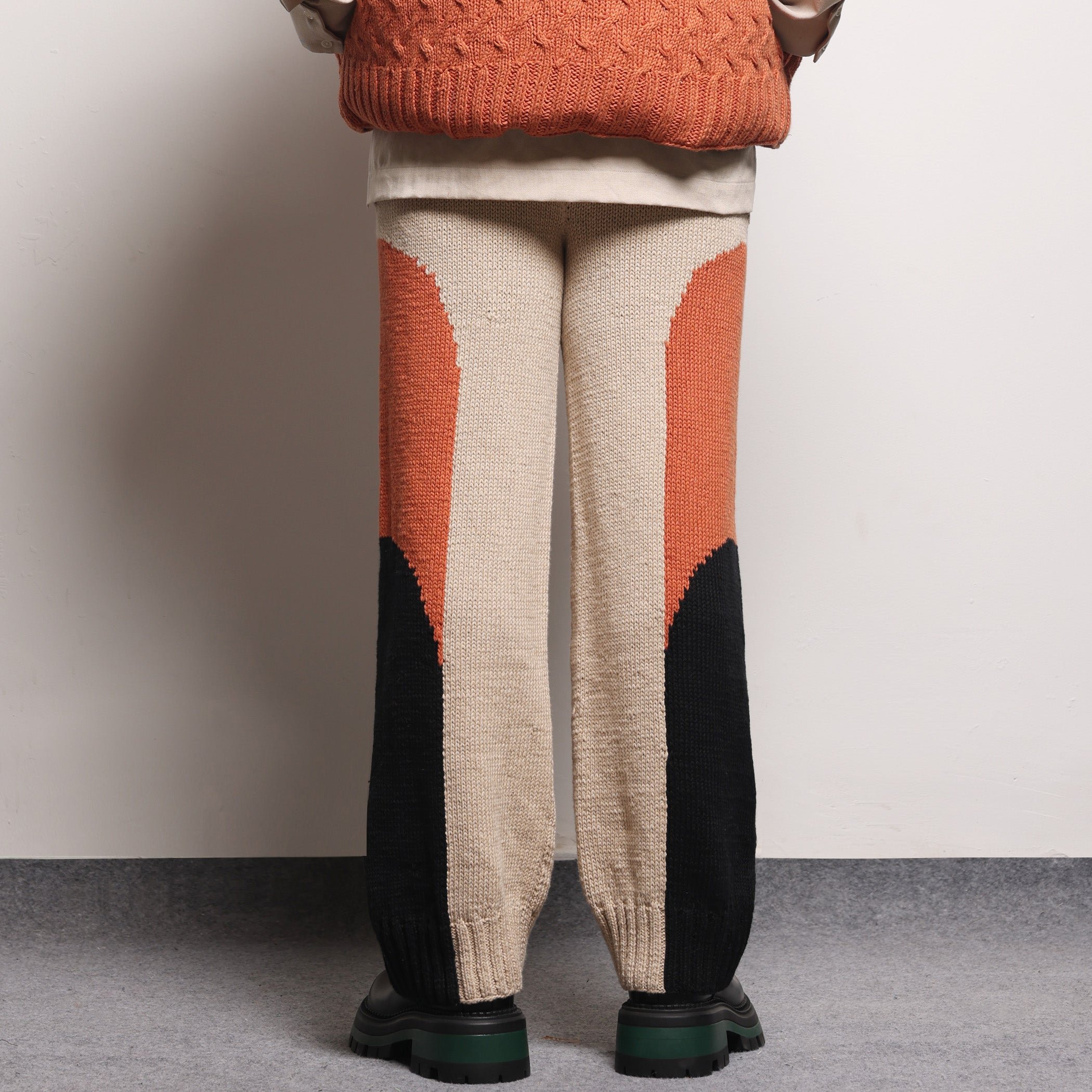 Nucleosome Handknit Trousers Orange styling frame
